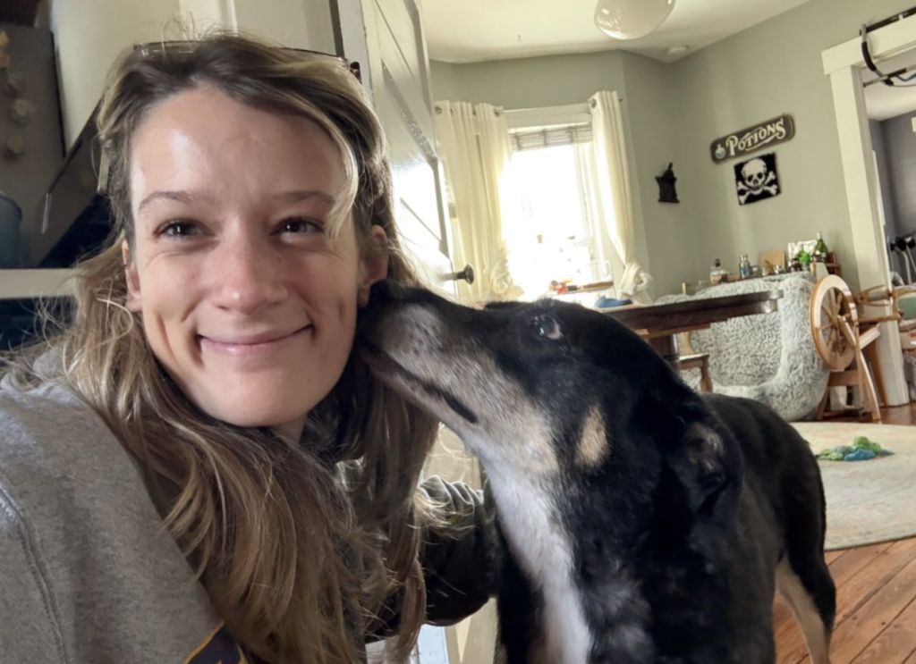 Professional dog walker providing personalized care for a senior dog during a visit in Columbus, Ohio