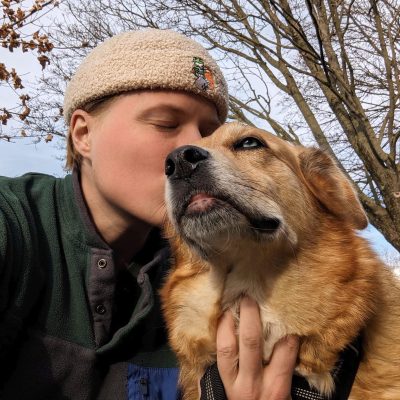 Hands N Paws dog walker sharing an affectionate moment with a Golden Retriever mix in Columbus, Ohio