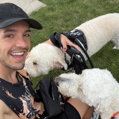Hands N Paws dog walker greeting two happy dogs during a Columbus dog walking visit